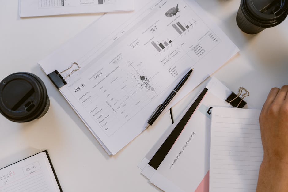 A vibrant and modern office setting with entrepreneurs engaged in a brainstorming session, surrounded by visual data analytics and call recording devices.