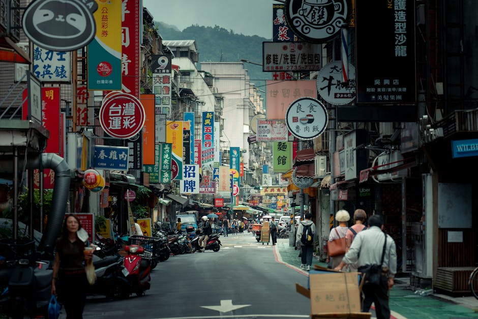 A bustling city street with various local businesses, each featuring signs with different area codes, showcasing a community-oriented vibe.