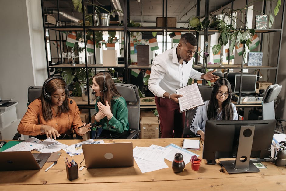 Visual showing a modern office setup with a team discussing customer service call data and insights, highlighting collaboration and technology.