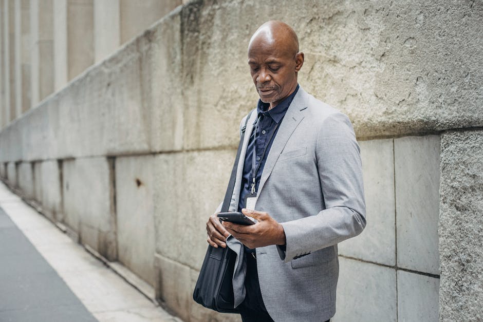 An image depicting a professional using their smartphone while on the move, illustrating seamless communication.