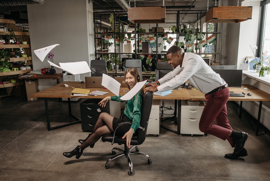 A playful office scene with a team laughing at a desk, showing the lighter side of business.