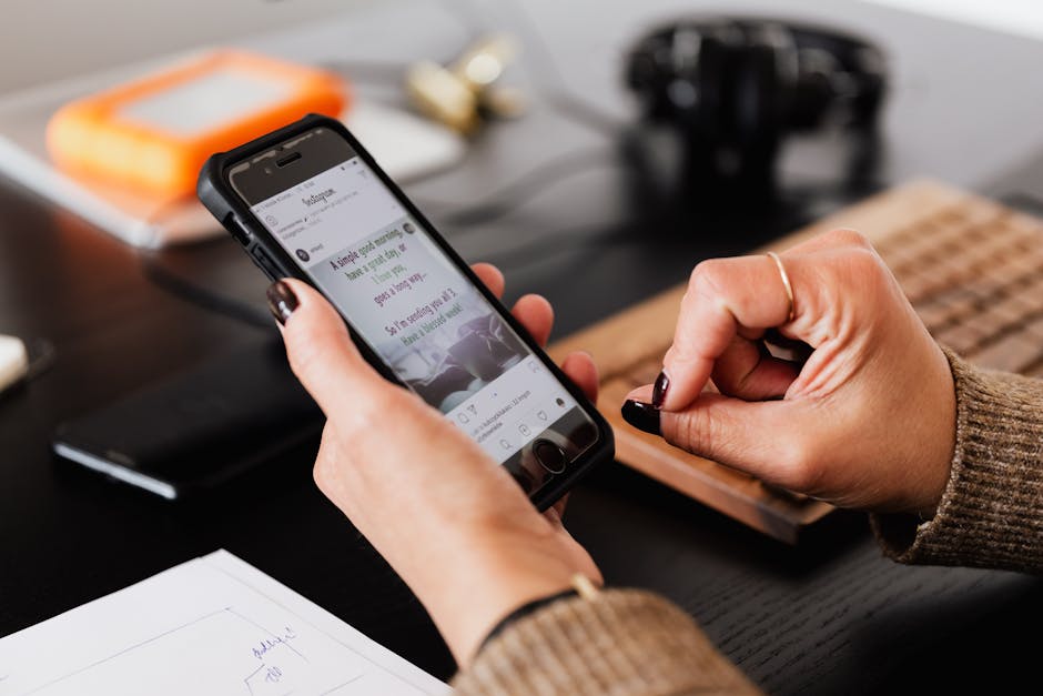 A professional office setting with a person recording a voice message on a modern office phone.
