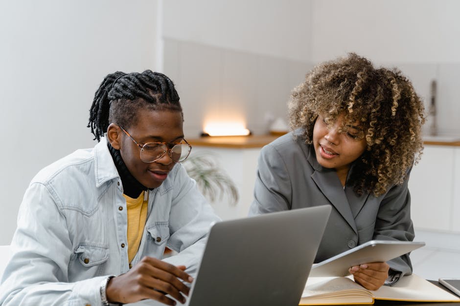 A vibrant office scene showcasing multiple employees engaging with clients via various communication devices, highlighting the blend of traditional and digital methods.