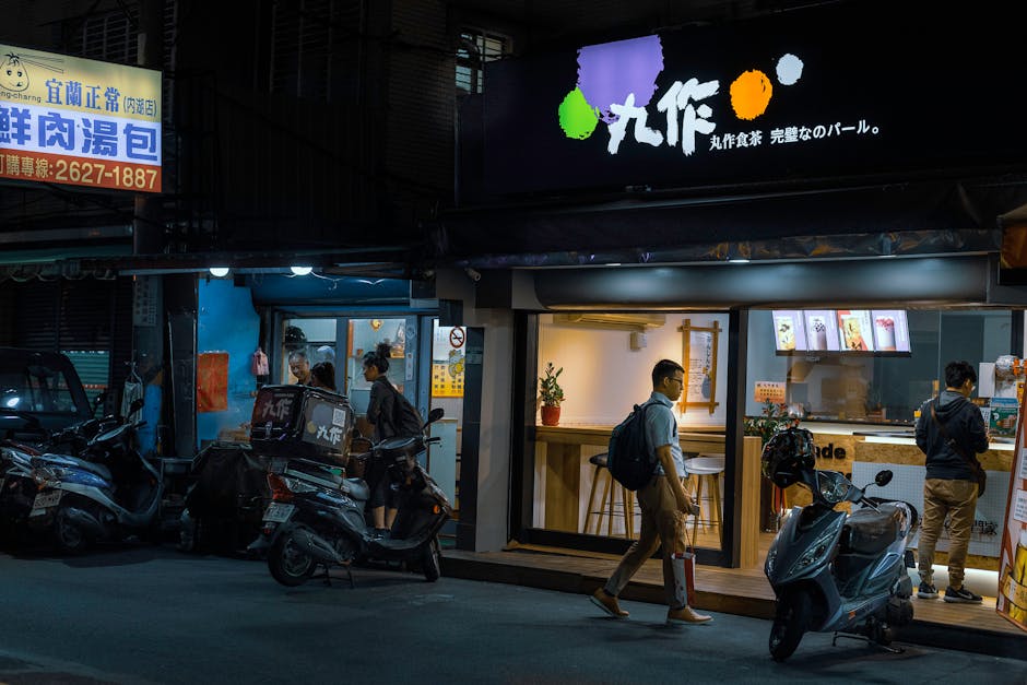 A vibrant and busy reception area with a seamless blend of human interaction and technology, depicting an AI Assistant helping customers.