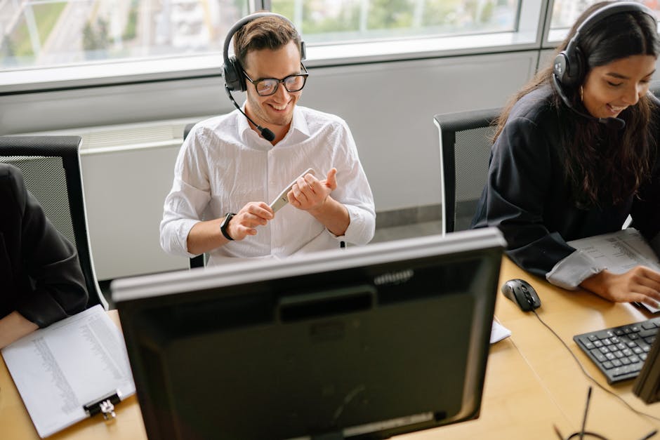 A dynamic office scene featuring a modern AI-powered front desk with employees engaged in interactive communication with clients.