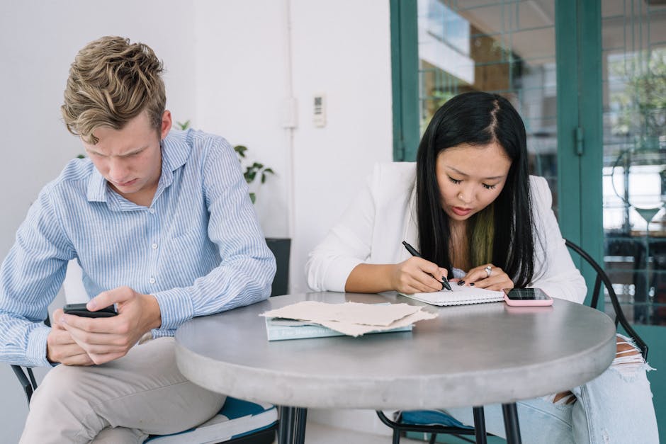 A warm, welcoming office setting with a phone, pen, and notepad to signify message-taking.