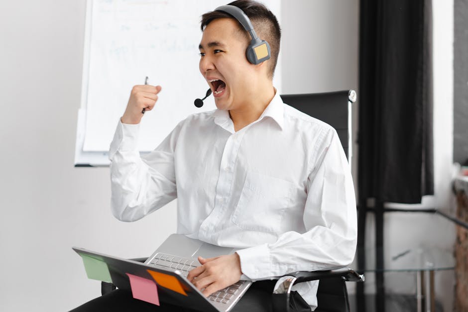 A person at a call center reviewing recordings on a computer screen, with customer service success metrics displayed nearby.