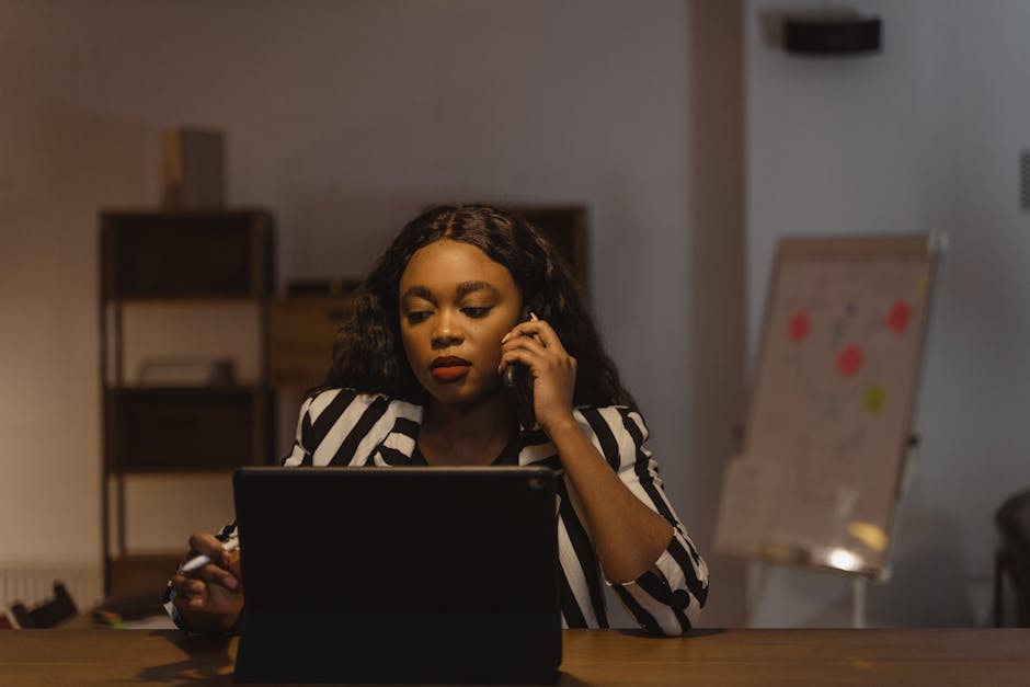 A busy office environment showcasing collaborative teamwork at a phone station, visually representing effective call management.