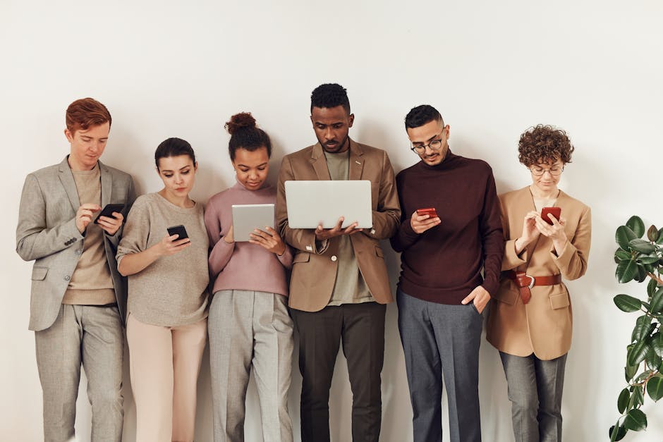 A dynamic image showing a diverse group of people interacting with their mobile devices, emphasizing communication through SMS and technology.