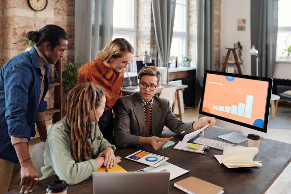 Image of a business team collaborating over a digital dashboard displaying VOIP usage analytics and communication metrics.