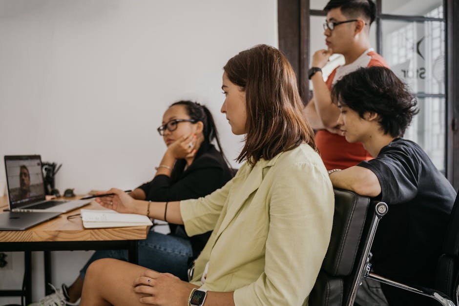 A group of diverse healthcare professionals engaging with patients through video calls and sending thank-you notes, enhancing their connection, with a digital interface showing appointment reminders in the background.