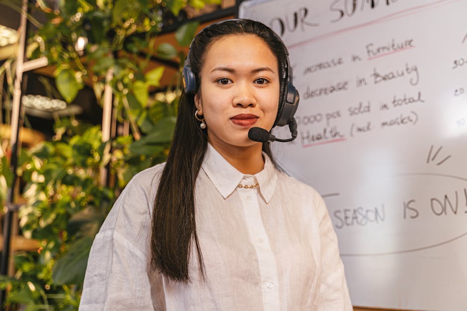 A stylish office environment showcasing employees engaged in seamless communication through advanced AI-powered VoIP clients, with modern technology in the background.
