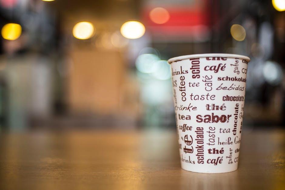 A vibrant and bustling specialty coffee shop with patrons enjoying their drinks and staff efficiently managing appointments.