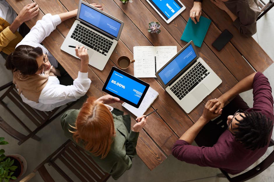 A modern office setting with a sleek AI receptionist interface on display, showcasing a seamless interaction between technology and human employees.