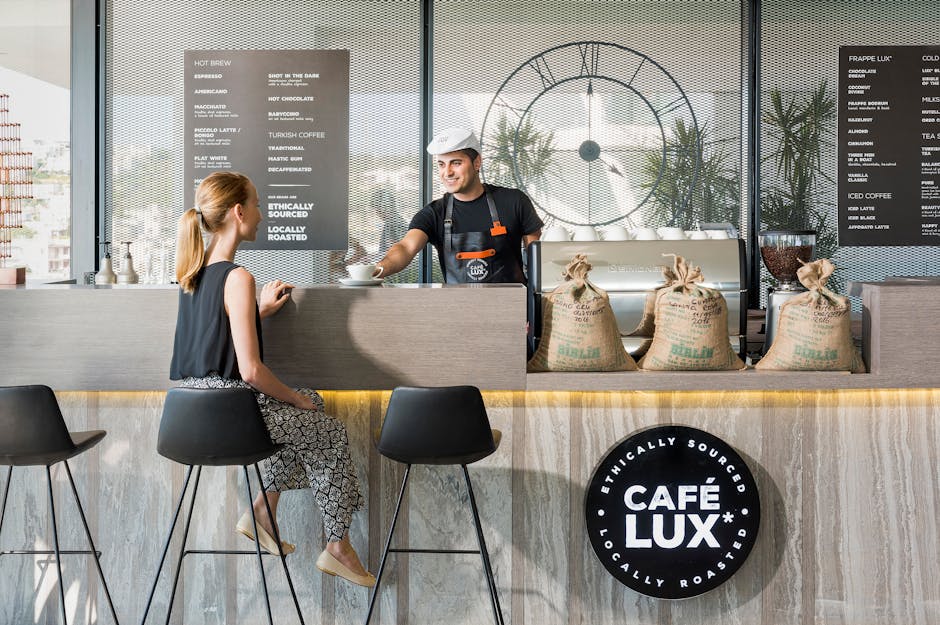 A vibrant coffee roasting workshop showcasing artisanal methods, with colorful bags of specialty coffee and an AI interface for customer interaction.