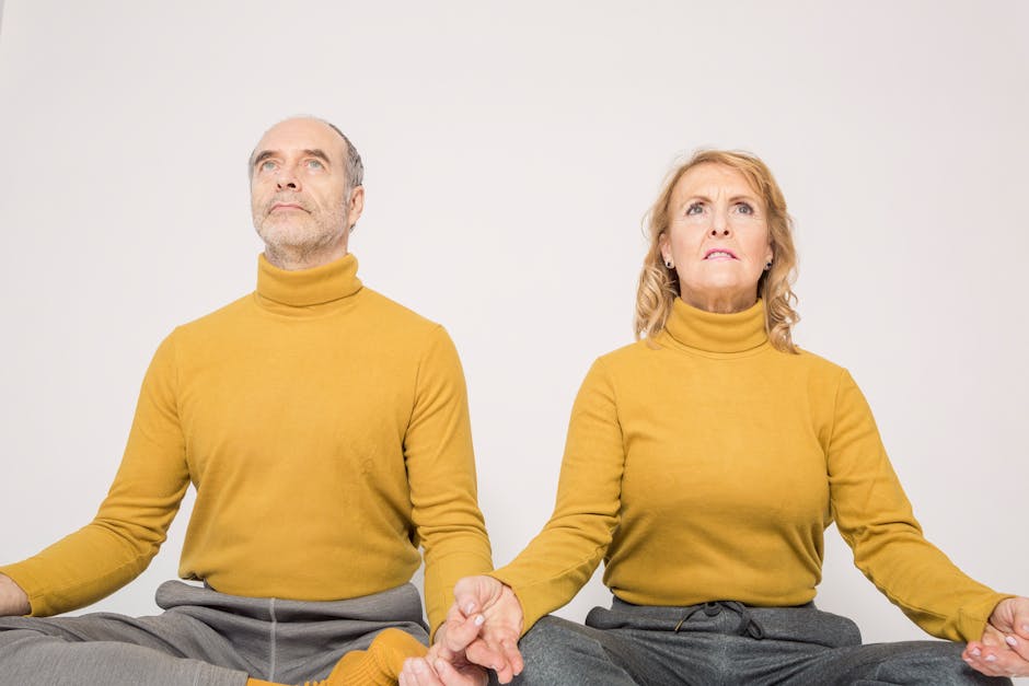 A serene yoga studio setting with soft lighting, people practicing yoga, and a welcoming atmosphere