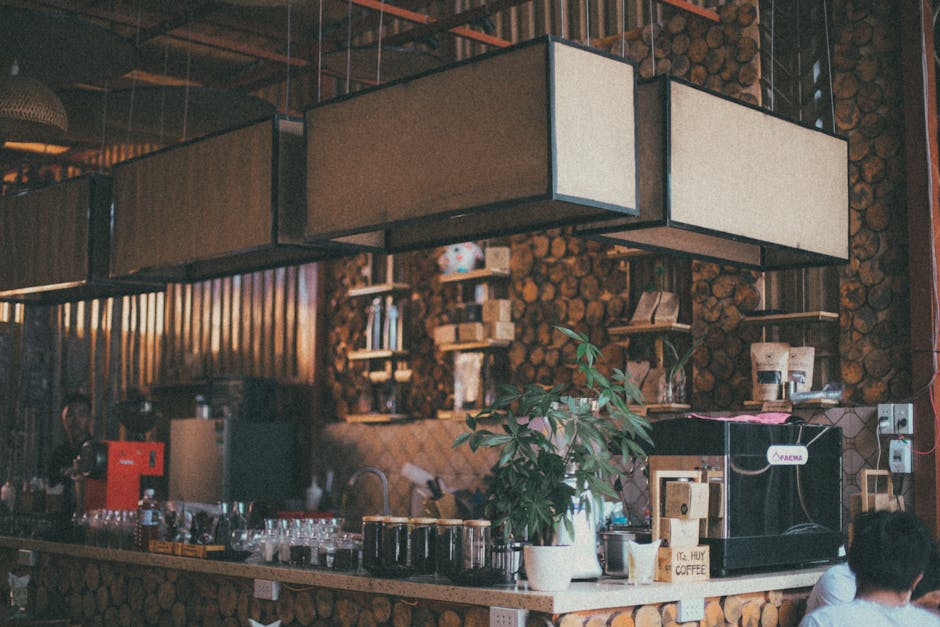 A cozy coffee shop interior with warm lighting, comfortable seating, and unique decor that reflects a distinct brand identity.