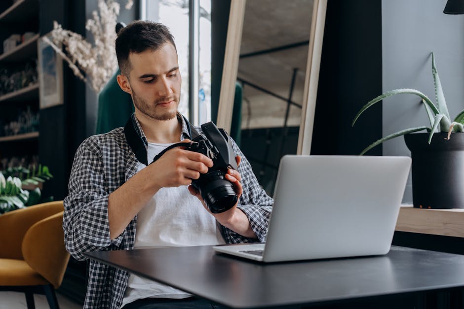A small business owner happily working at a desk with a digital assistant on the screen, showcasing modern technology.