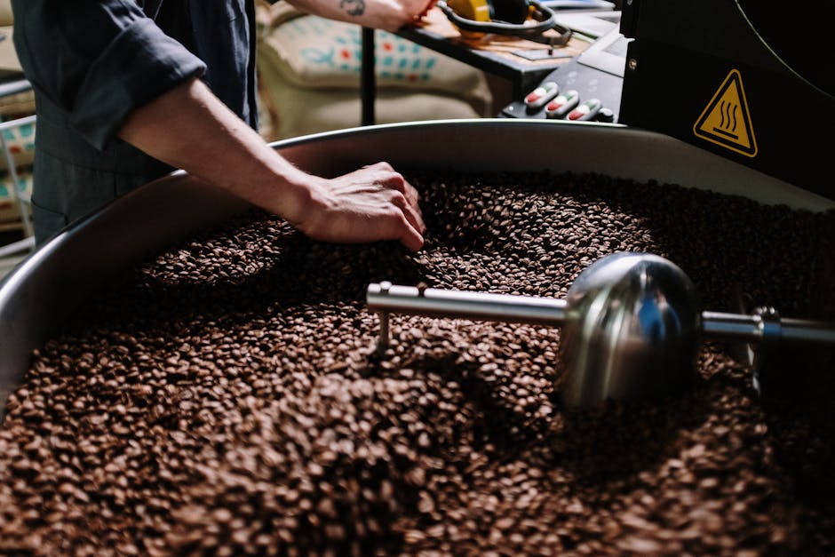 A team of coffee roasters in action, with vibrant coffee beans and equipment around them.