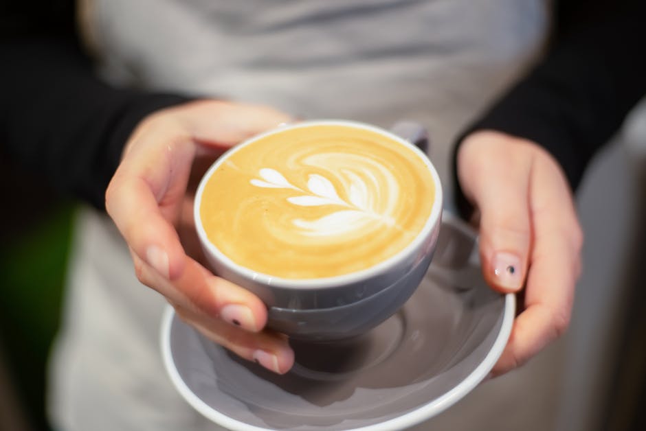 A skilled barista showcasing coffee roasting techniques in a cozy, inviting coffee shop setting.