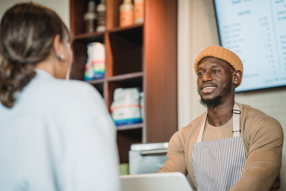 A cozy and inviting retail environment with smiling staff interacting with customers.