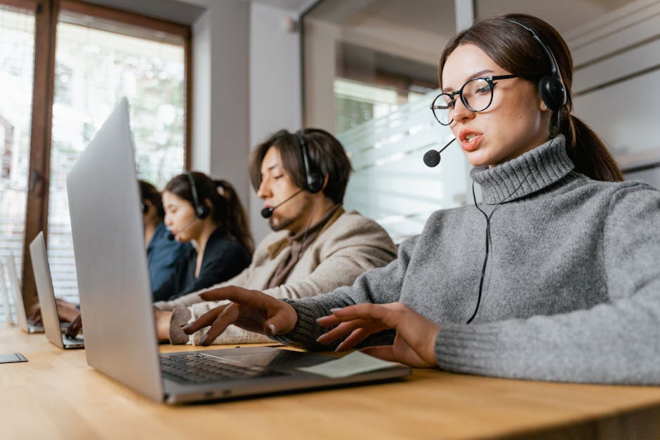 A customer service representative interacting with an AI-driven interface, highlighting a modern, tech-savvy environment.