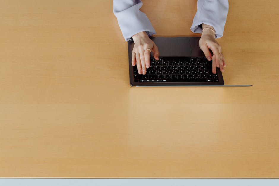 A sleek office environment featuring professionals using digital devices to send and receive documents, showcasing the transition from traditional fax machines to modern virtual communication.