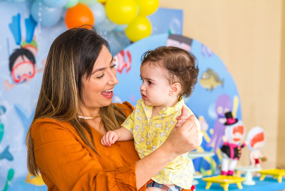 A warm, engaging image showing a child care worker happily communicating with parents over a phone and tablet, with cheerful children playing in the background.