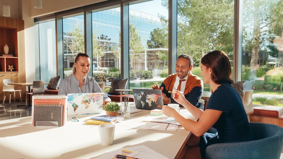 A vibrant workspace showing a group of diverse entrepreneurs collaborating and using AI tools for efficient business communication.