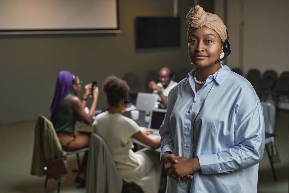 A dynamic office environment showcasing employees managing calls effectively, with visual cues of communication enhancement and technology integration.