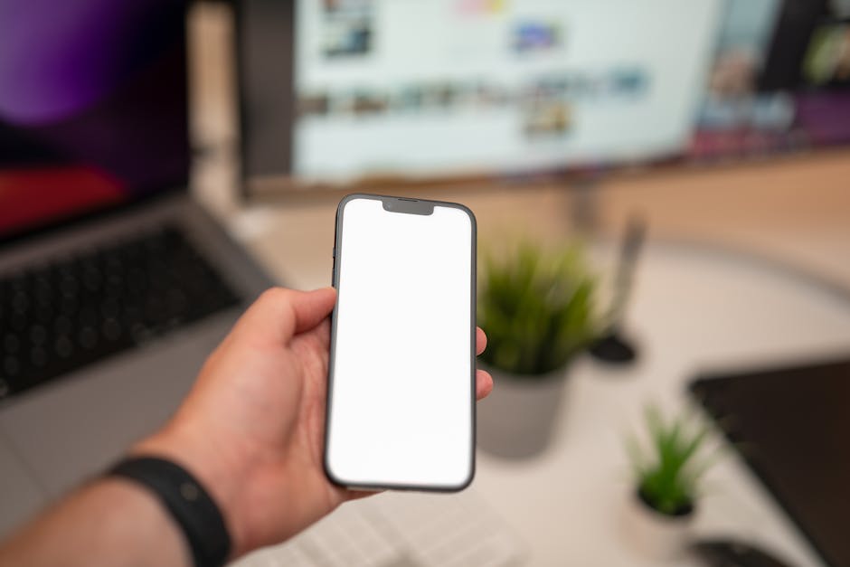 A modern office setting showcasing a business professional engaging with a smartphone displaying a call answering app interface.