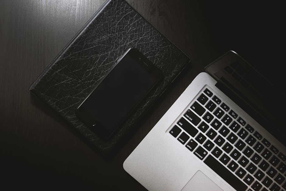 A modern office setting featuring two iPhones on a desk with call forwarding highlighted on the screen, symbolizing efficient business communication.