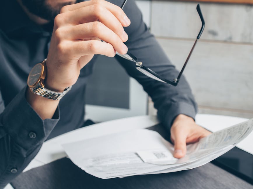Image of a business professional smoothly transferring a phone number while reviewing paperwork, symbolizing the porting process.