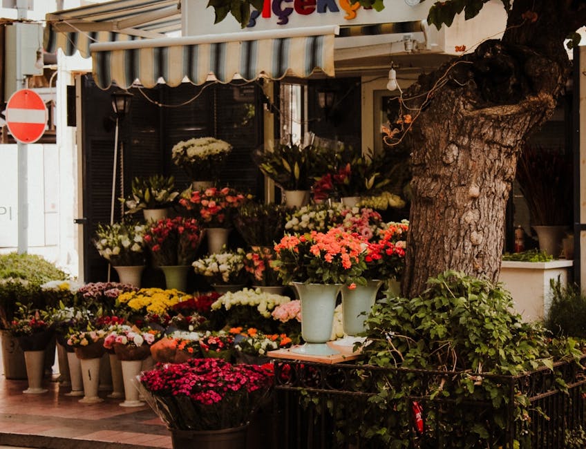 A thriving urban garden on a rooftop, showcasing a variety of plants and flowers, integrates nature beautifully within city life.