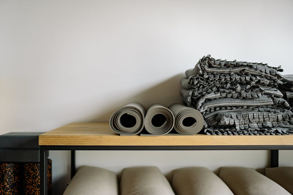 A serene yoga studio setting with soft lighting and mats arranged for a class, reflecting a peaceful atmosphere.