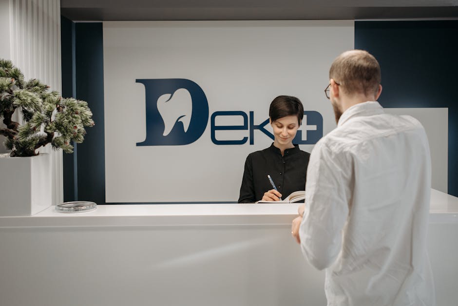 A vibrant, inviting reception area with a receptionist engaging warmly with a client over the phone.
