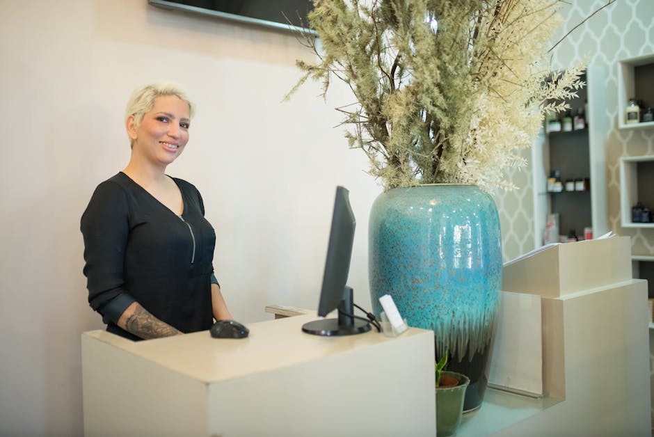 A welcoming AI receptionist with a friendly expression, set in a modern office environment.