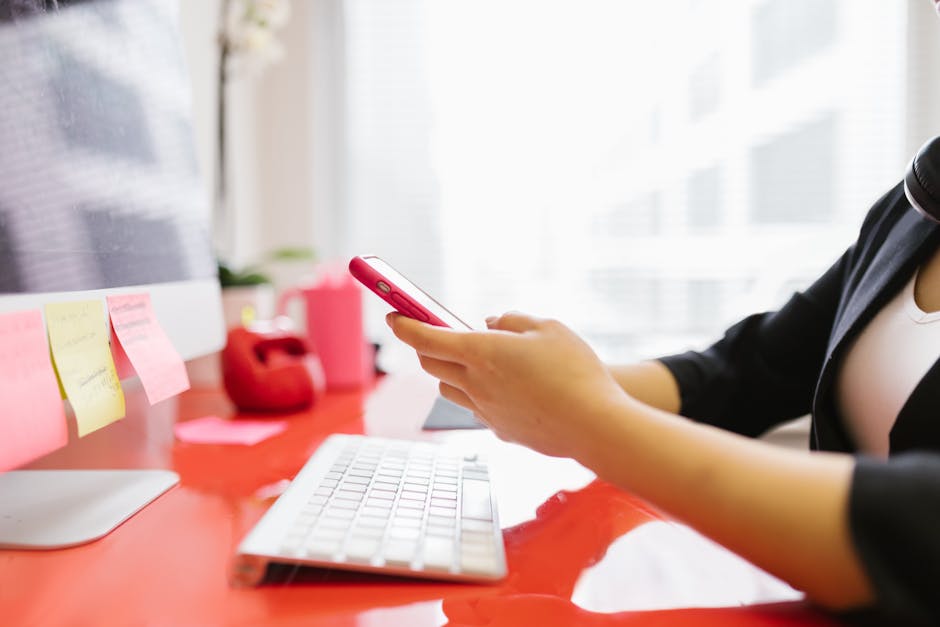 A business professional checking notifications on their smartphone, with a focus on seamless connectivity and engagement.