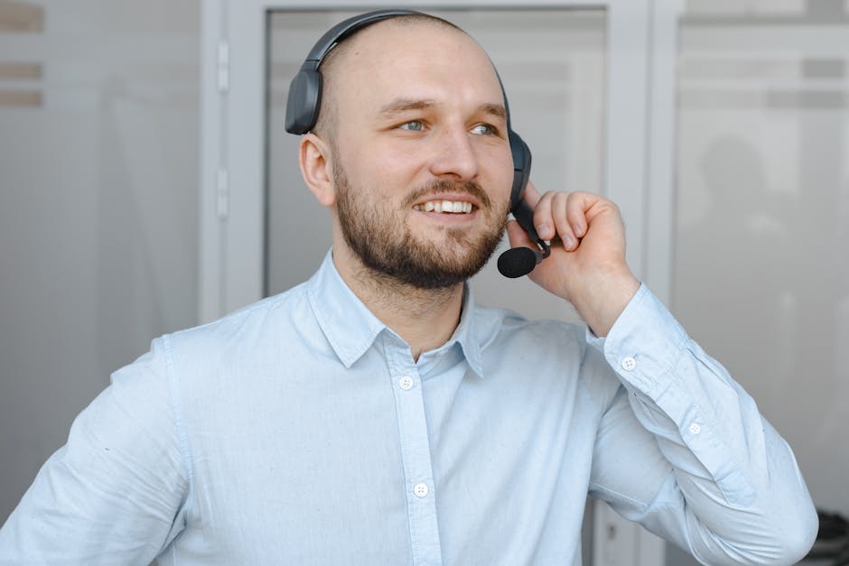 A business professional engaging with a customer, symbolizing communication and responsiveness.
