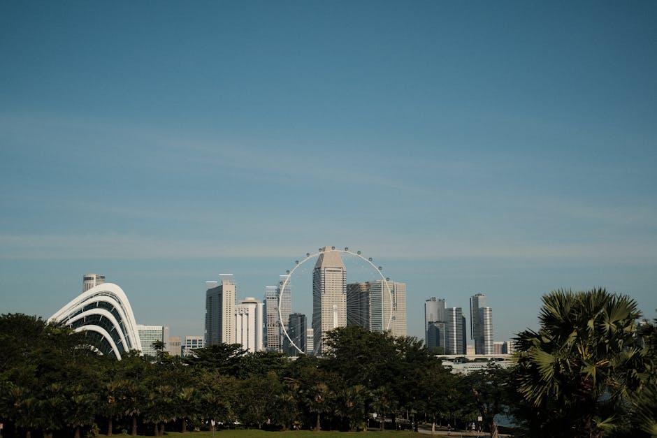A vibrant city skyline featuring several buildings with lush green roofs, illustrating the benefits of nature in urban settings.
