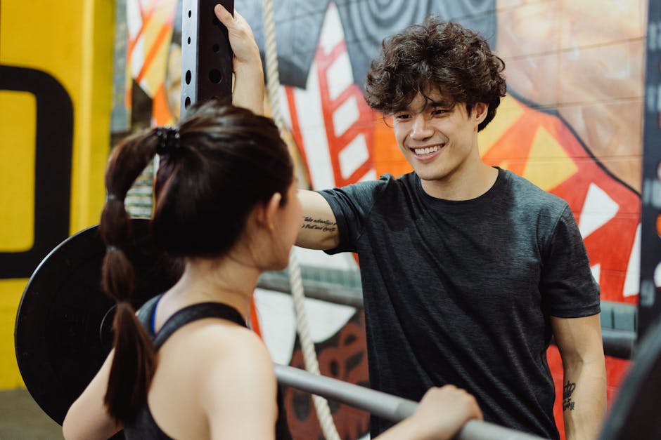 A friendly gym agent on the phone, engaging in conversation with a potential member in a modern, vibrant gym setting