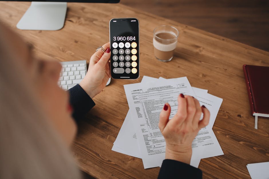A person using their smartphone while considering different phone plans and options to port their number