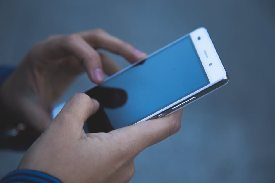 A sleek smartphone displaying two distinct contact lists: one for personal and one for business.