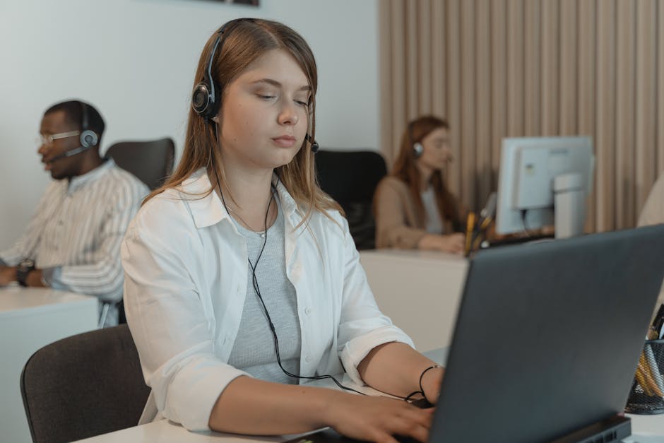 A professional-looking office space with a person on the phone, demonstrating attentive customer service.