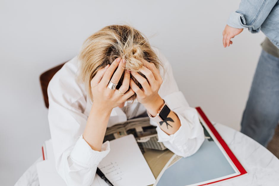 A modern office setting with a frustrated employee dealing with a phone, illustrating the challenge of unwanted calls.