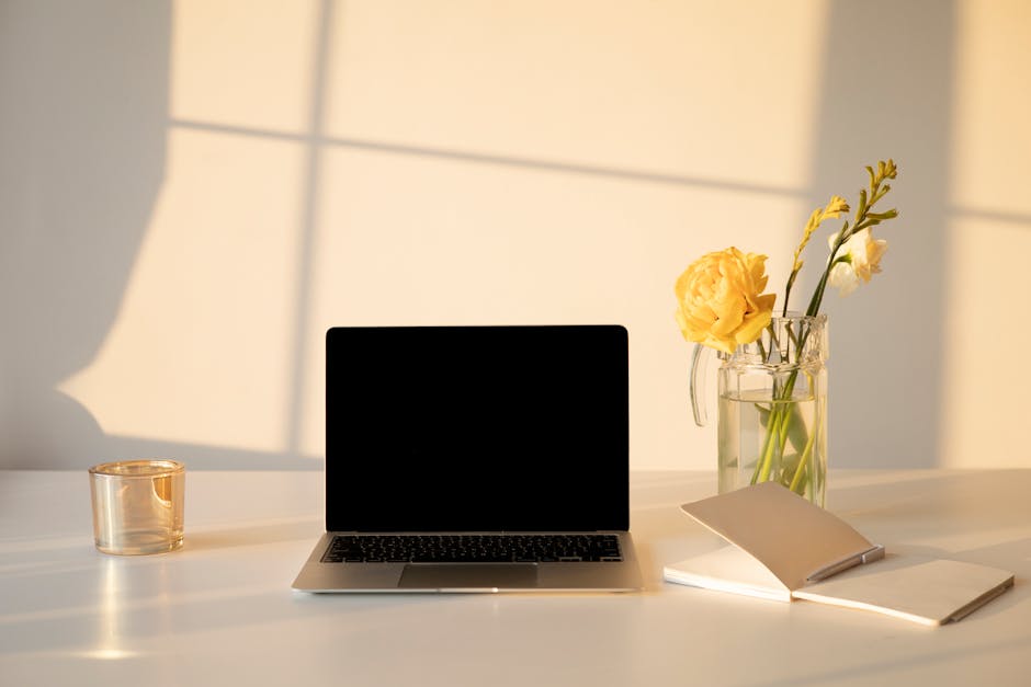A serene office space featuring soft lighting with a desk and a phone, symbolizing a welcoming environment for psychotherapy.