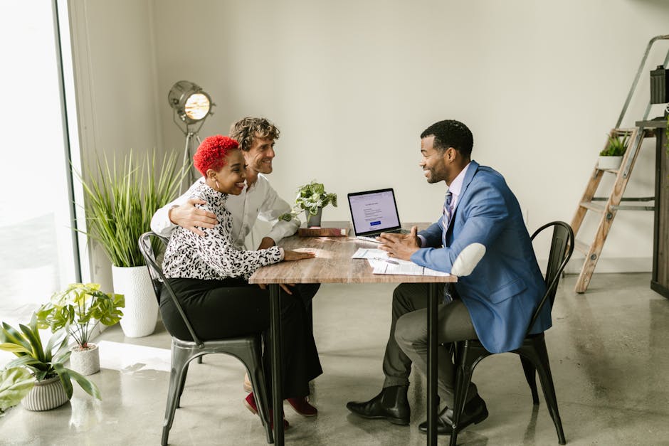 A dynamic image showing a photographer engaging in a consultation with a client, emphasizing a friendly and professional interaction.