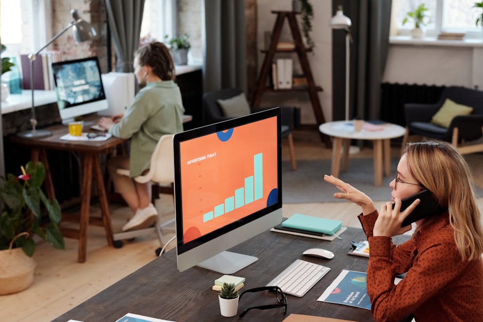 A vibrant graphic showing a business professional using a smartphone and a desk phone simultaneously, illustrating seamless communication.