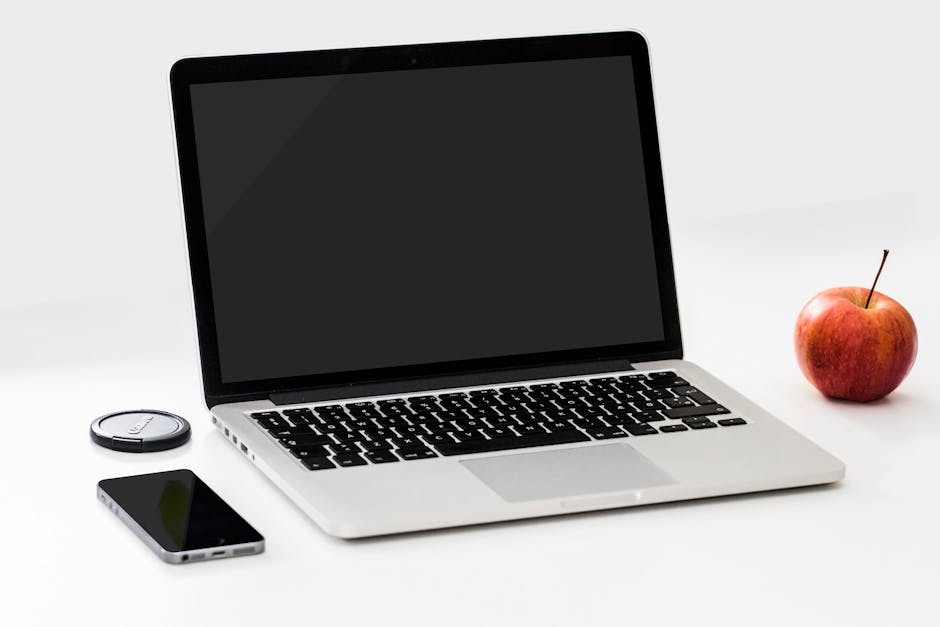 A sleek, modern workspace featuring both a business phone and a mobile device, showcasing integrated technology.