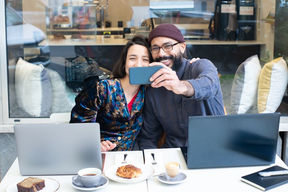 A streamlined workspace showcasing a smartphone with a happy customer interacting via a business number.
